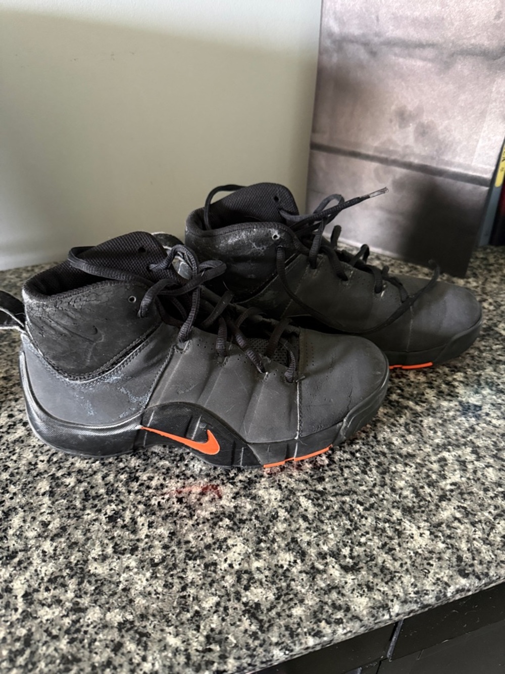 Nike Men's Black High-Top Athletic Shoes with Orange Swoosh
